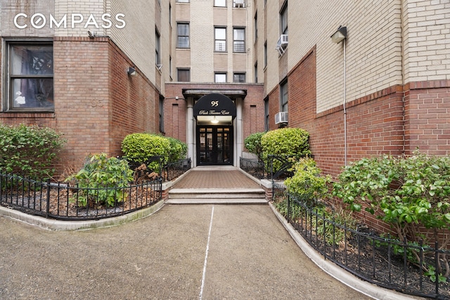 95 Park Ter E Unit 3B, New York City, NY 10034 - property entrance featuring brick siding and cooling unit