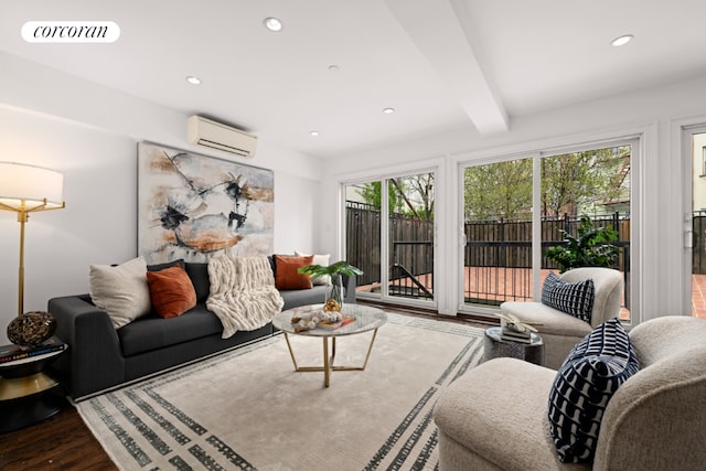 living room featuring a wall mounted air conditioner, beam ceiling, and hardwood / wood-style floors