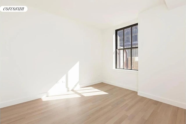 spare room featuring light wood-type flooring