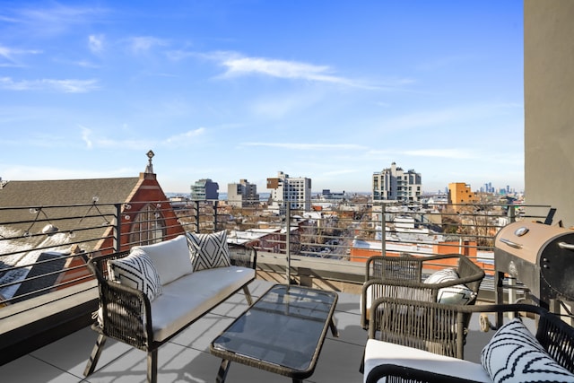 view of patio featuring a balcony, a view of city, and an outdoor living space