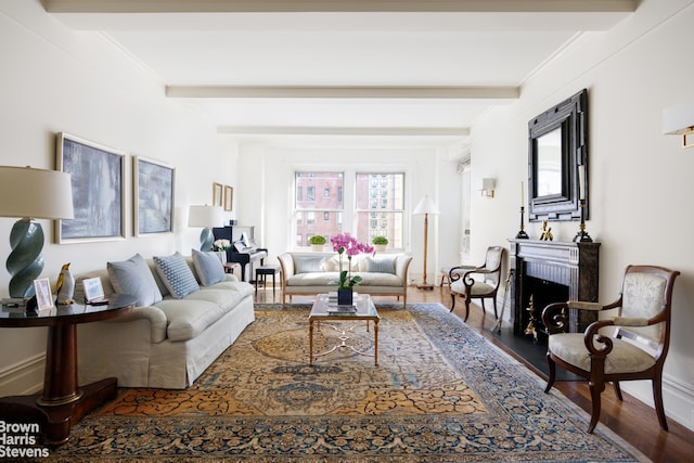 living room with beamed ceiling, crown molding, and hardwood / wood-style floors