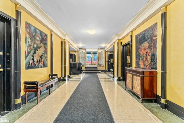 corridor with granite finish floor, baseboards, and ornamental molding