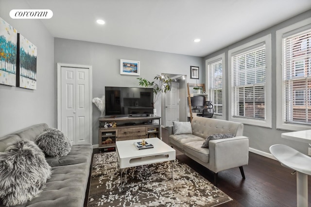 living area featuring recessed lighting, visible vents, baseboards, and wood finished floors