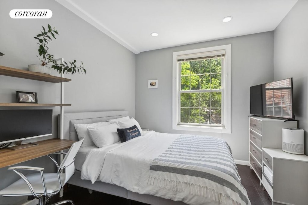 bedroom featuring dark hardwood / wood-style flooring