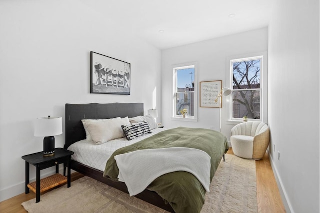 bedroom with light hardwood / wood-style floors