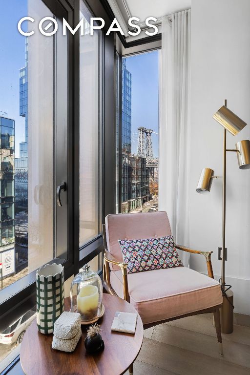 living area featuring a city view and wood finished floors