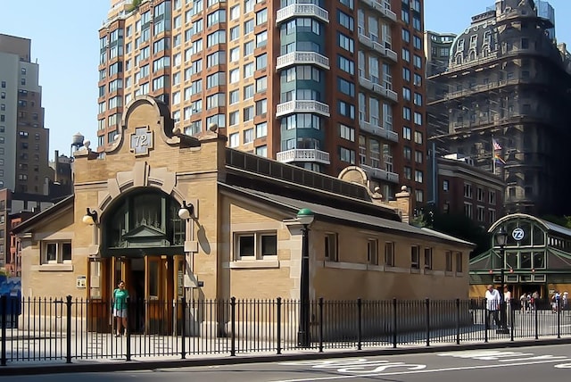 view of property featuring a view of city and fence