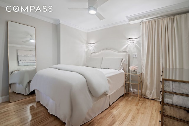 bedroom with crown molding, ceiling fan, and hardwood / wood-style floors