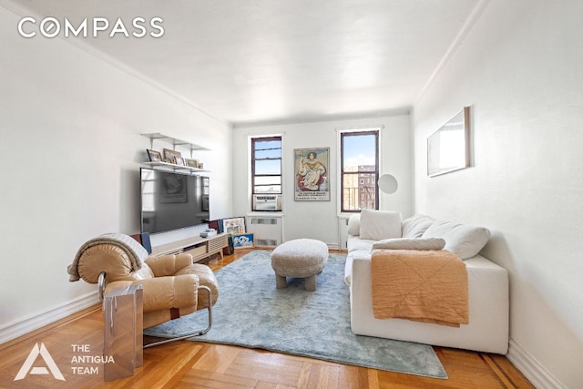 living room featuring radiator and parquet floors