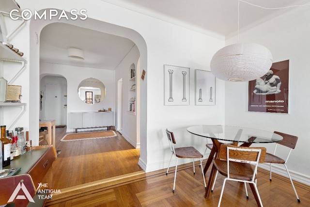 dining area with hardwood / wood-style flooring