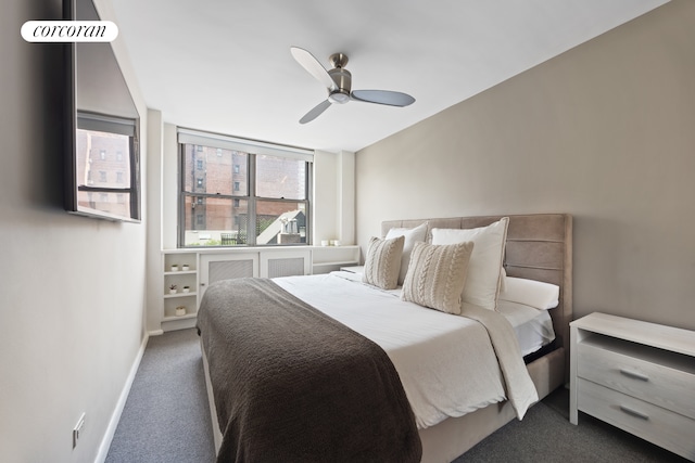 carpeted bedroom featuring baseboards and a ceiling fan