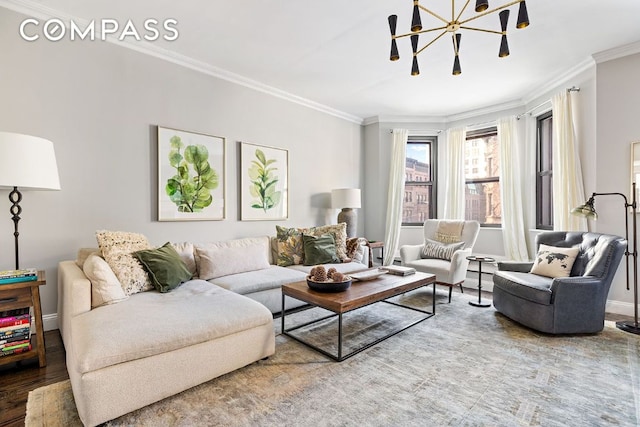 living room with a notable chandelier, hardwood / wood-style flooring, and ornamental molding