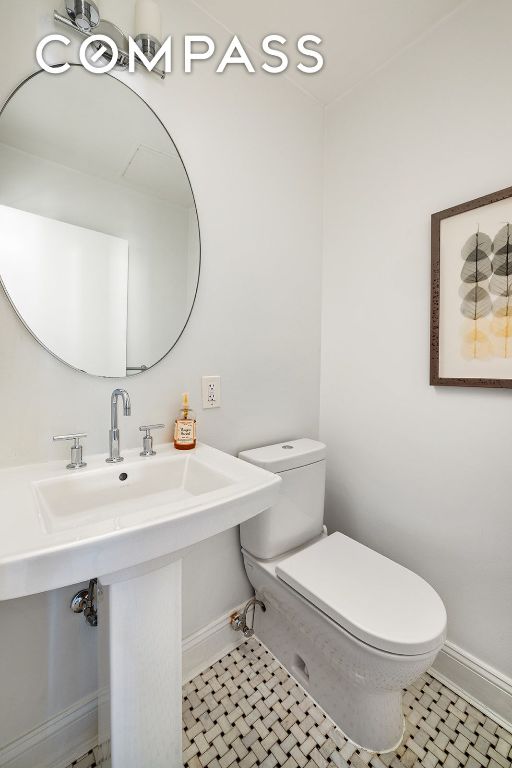 bathroom with tile patterned floors and toilet