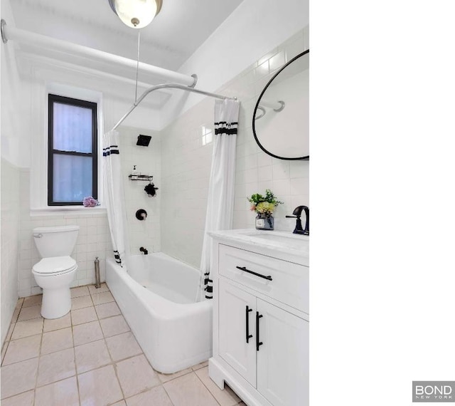 full bathroom with tile walls, vanity, toilet, shower / bathtub combination with curtain, and tile patterned floors