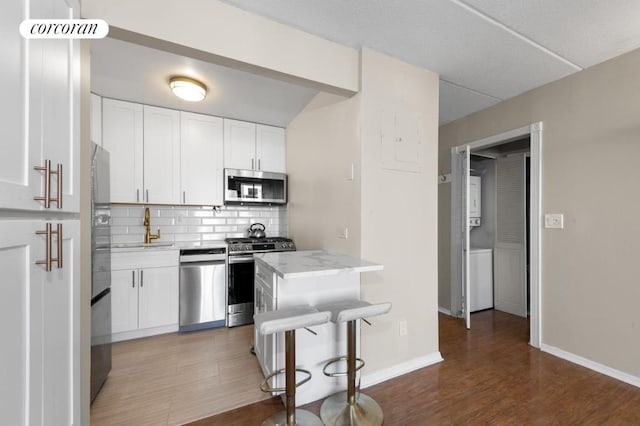 full bathroom featuring shower / bath combination, vanity, a textured ceiling, and toilet