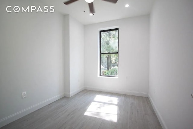 unfurnished room featuring ceiling fan and light hardwood / wood-style floors