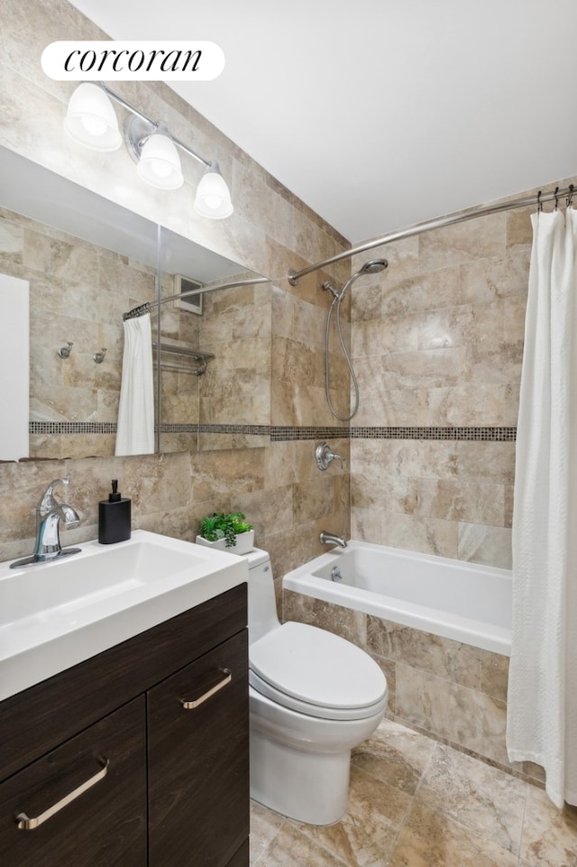 full bath with tiled shower / bath, toilet, tile walls, decorative backsplash, and vanity