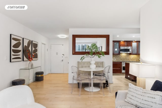 dining area with light hardwood / wood-style flooring