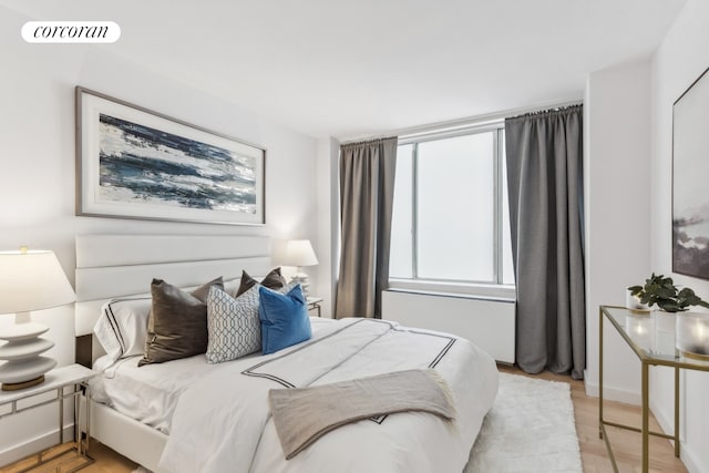 bedroom with visible vents and light wood-style floors