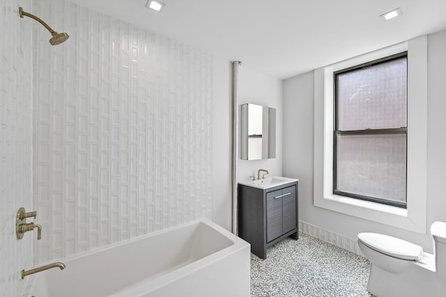 full bathroom featuring vanity, shower / tub combination, and toilet