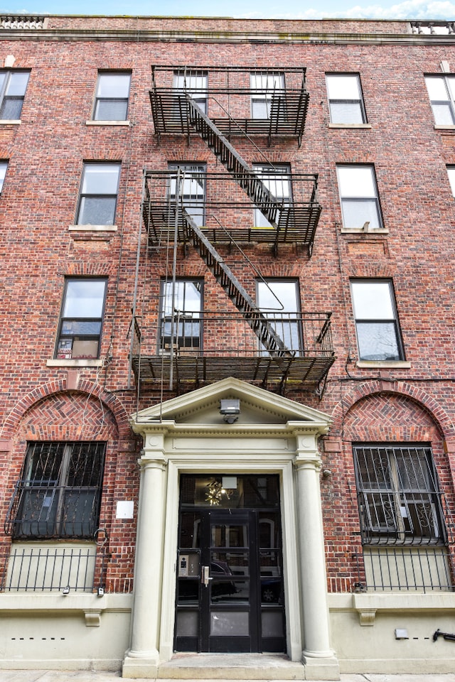 view of property featuring stairs