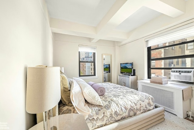 bedroom featuring beamed ceiling, coffered ceiling, radiator heating unit, and cooling unit