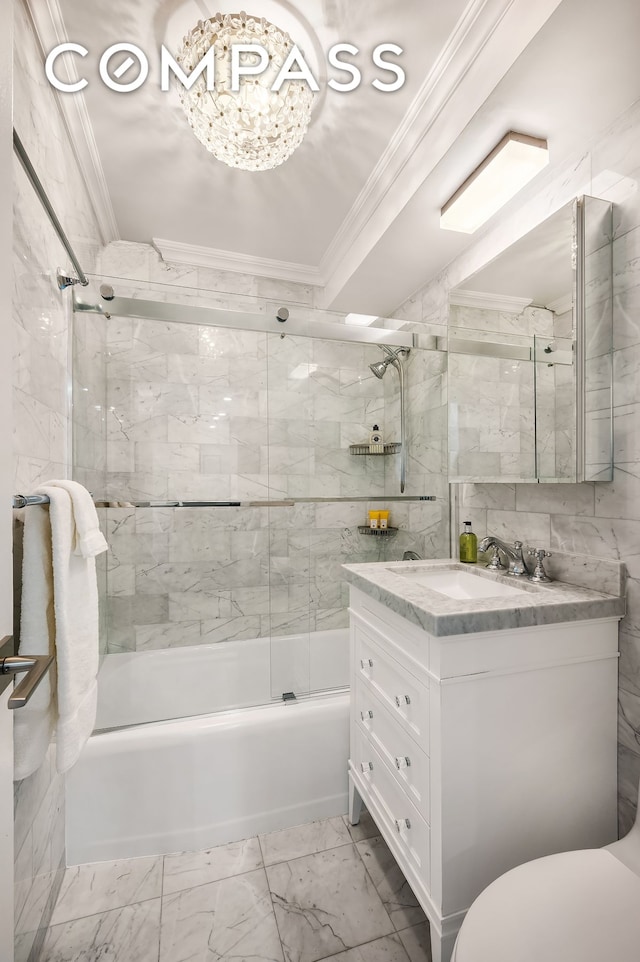 bathroom with marble finish floor, crown molding, vanity, and bath / shower combo with glass door