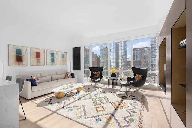 living area with a city view and wood finished floors