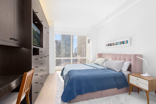 bedroom with light wood-style flooring