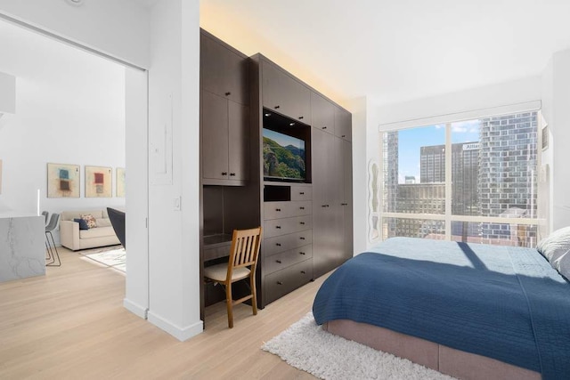 bedroom with light wood-style flooring