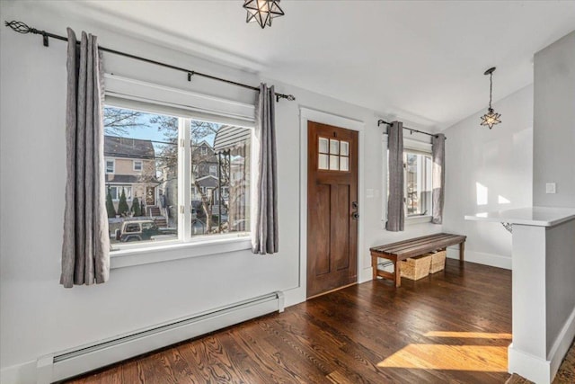 entrance foyer featuring dark hardwood / wood-style floors and baseboard heating