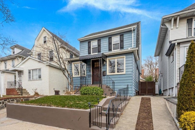 view of front of home with a front yard