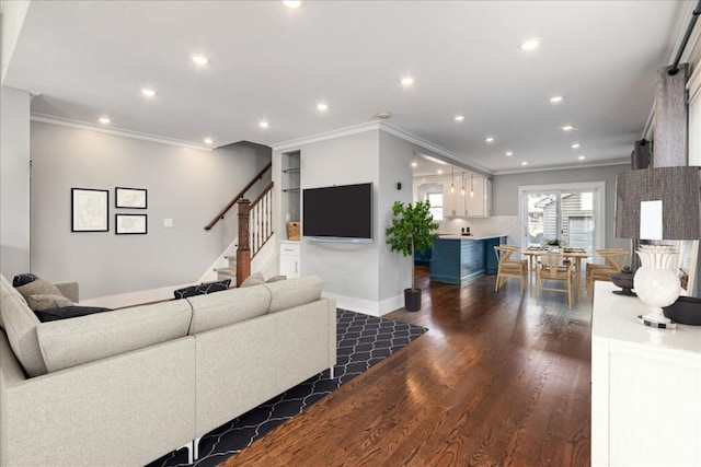 living room featuring dark wood-type flooring and crown molding