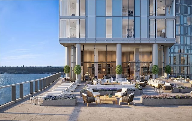 view of patio / terrace featuring an outdoor living space and a water view