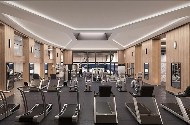 gym featuring wood walls