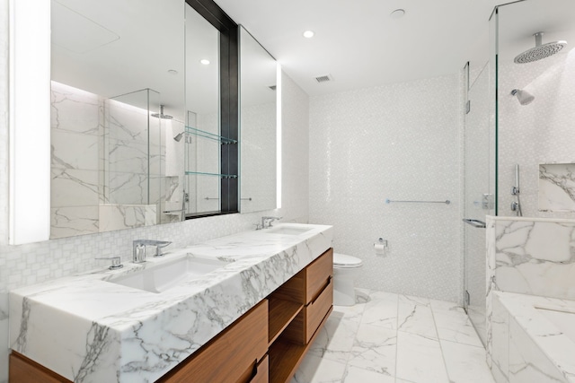 bathroom with vanity, toilet, and walk in shower