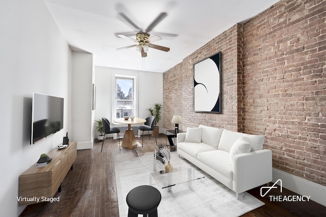 154 W 77th St Unit 4R, New York City, NY 10024 - living room featuring brick wall, ceiling fan, hardwood / wood-style floors, and baseboards