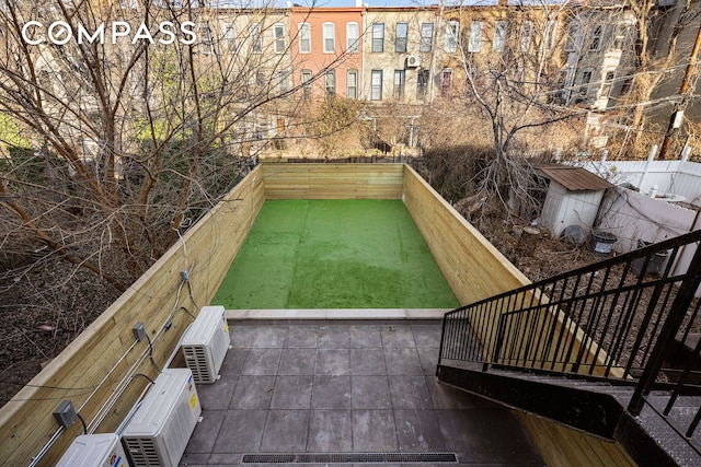 view of swimming pool featuring fence and ac unit