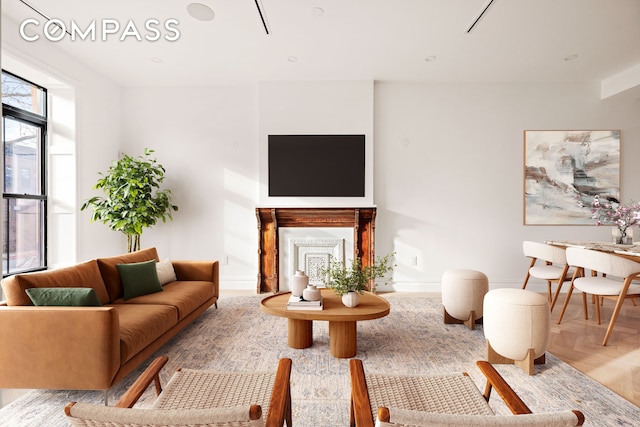 living area featuring baseboards