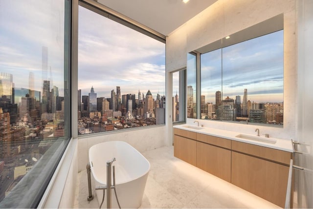 bathroom with vanity and a tub to relax in