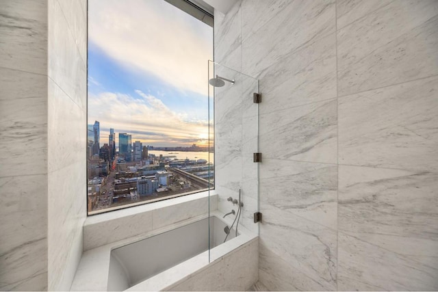 bathroom with a tile shower