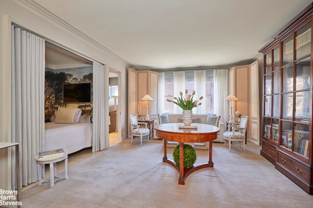 interior space with ornamental molding and light carpet