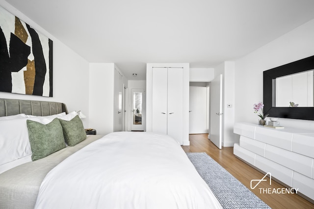 bedroom with a closet and wood finished floors