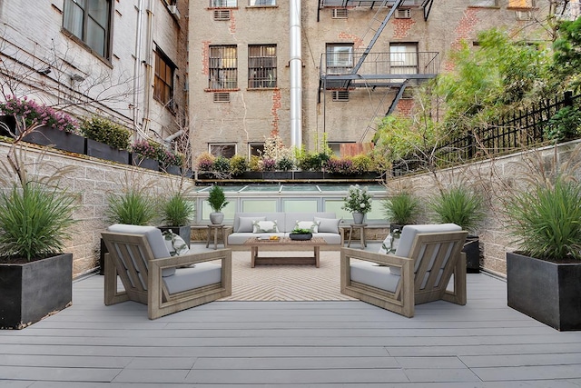 wooden terrace featuring outdoor lounge area