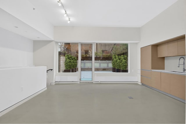 459 W 18th St Unit 1, New York City, NY 10011 - unfurnished living room with concrete flooring and a sink