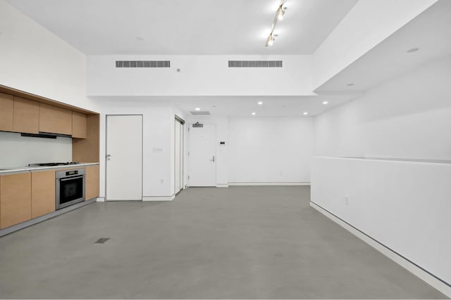 459 W 18th St Unit 1, New York City, NY 10011 - kitchen featuring stainless steel oven, gas cooktop, finished concrete floors, recessed lighting, and light countertops