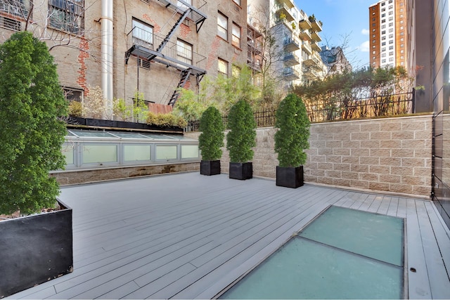 459 W 18th St Unit 1, New York City, NY 10011 - wooden deck featuring fence