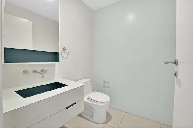 459 W 18th St Unit 1, New York City, NY 10011 - half bathroom with toilet, tile patterned floors, and vanity