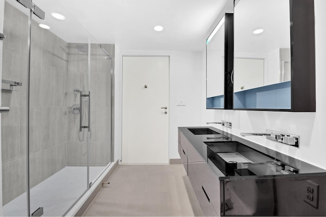 459 W 18th St Unit 1, New York City, NY 10011 - bathroom featuring a shower stall, double vanity, and recessed lighting