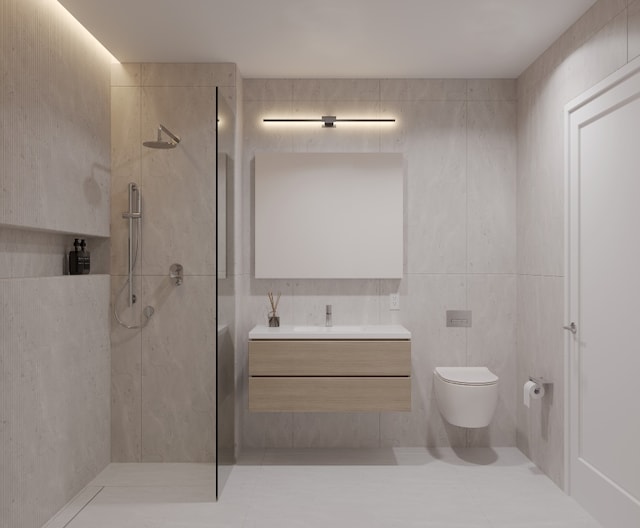 bathroom featuring walk in shower, vanity, toilet, and tile walls